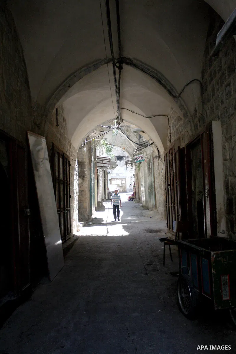 A Palestinian boy walks in the Old City of Nablus in the West Bank on July 18, 2011. Photo by Wagdi Eshtayah