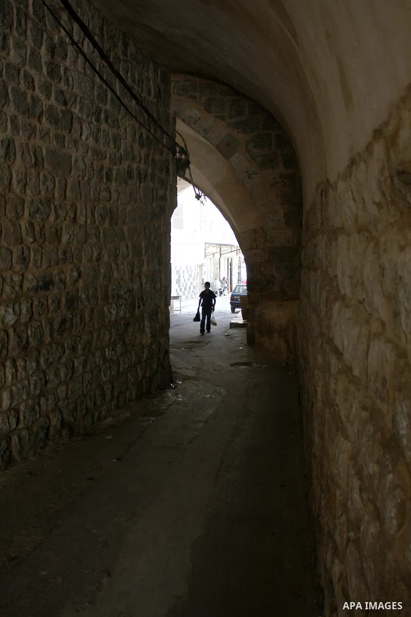 A Palestinian boy walks in the Old City of Nablus in the West Bank on July 18, 2011. Photo by Wagdi Eshtayah