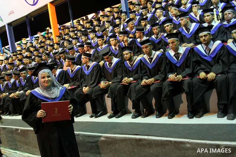 Palestinian students participate in their graduation ceremony at the University College of Applied Sciences in Gaza city on July18, 2011. Photo by Mohammed Asad