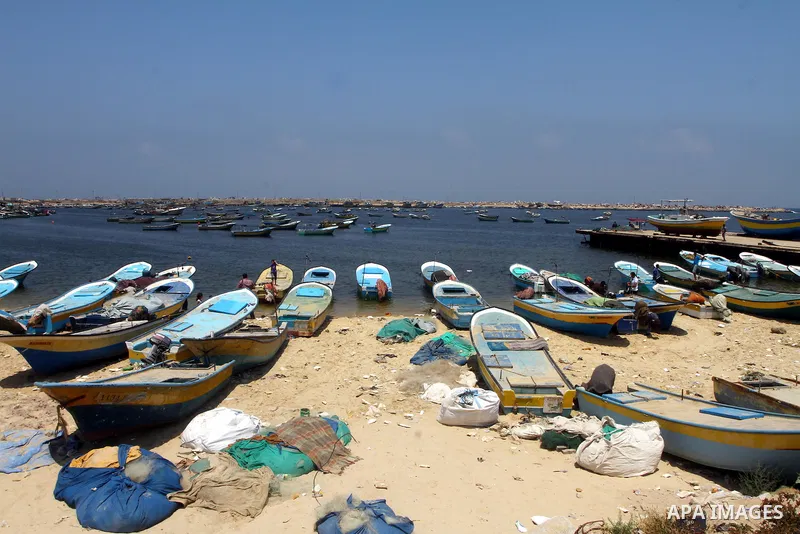 Palestinian fishermen ride a boat at the Gaza seaport on July 19, 2011. The Israeli navy on Tuesday boarded a French yacht carrying pro-Palestinian activists intending to sail to the blockaded Gaza Strip and forced it to...
