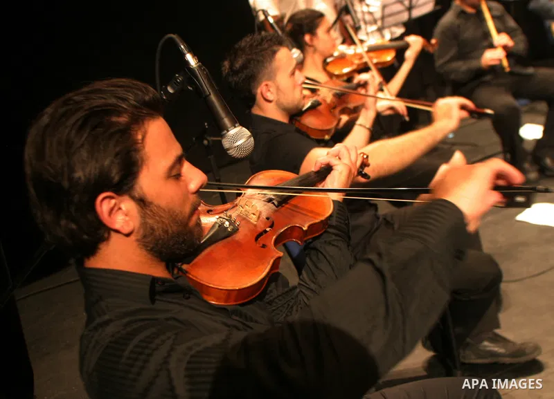 Palestinians perform during a musical concert at Al-Hakawati theatre in Jerusalem on July 19,2011. Photo by Mahfouz Abu Turk
