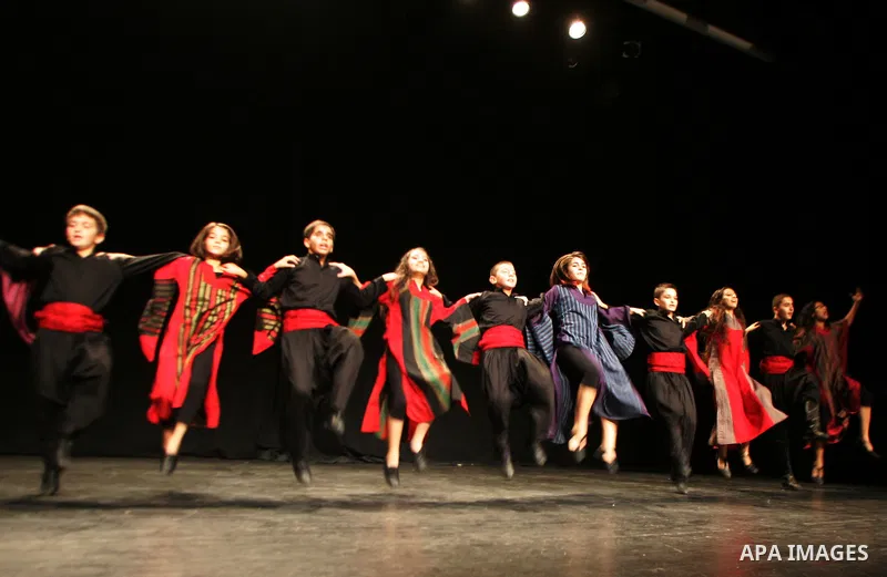 Palestinian children dance the traditional Dabka during a musical concert at Al-Hakawati theatre in Jerusalem on July 19,2011. Photo by Mahfouz Abu Turk