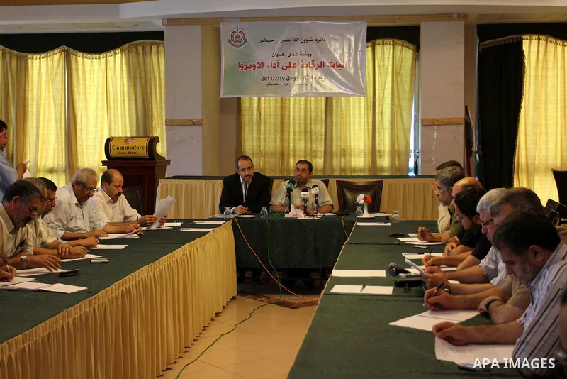 Palestinian Hamas department of Refugees members participate in a meeting to discuss the work of UNRWA in the Gaza Strip, Gaza city on July 19, 2011. Photo by Mohammed Asad