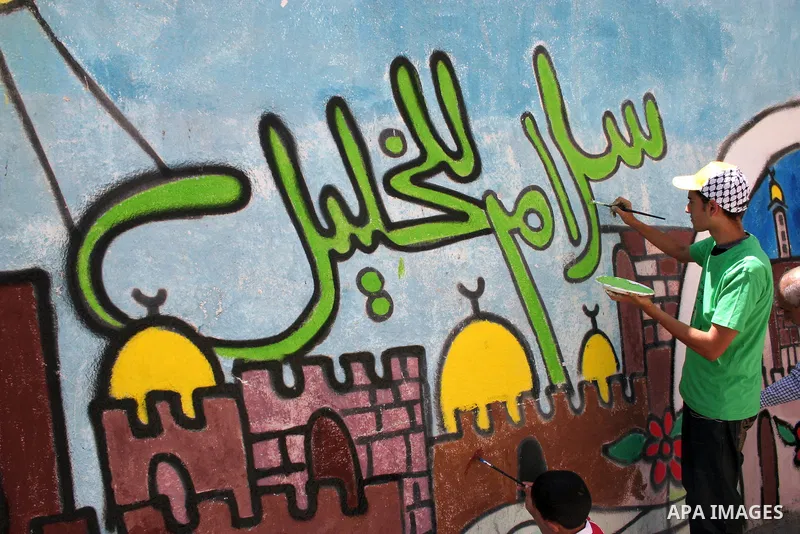 Palestinians participate in the International Conference to develop the centers of the historical cities and develop their economical situation, in the West Bank city of Hebron on July 19,2011. Photo by Najeh Hashlamoun