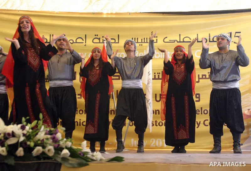 Palestinians participate in the International Conference to develop the centers of the historical cities and develop their economical situation, in the West Bank city of Hebron on July 19,2011. Photo by Najeh Hashlamoun