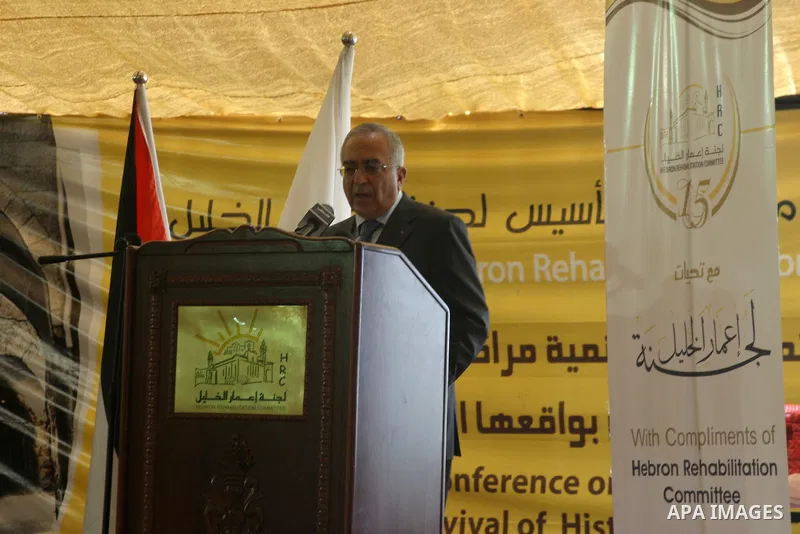 Palestinian prime minister Salam Fayyad participates in the International Conference to develop the centers of the historical cities and develop their economical situation, in the West Bank city of Hebron on July 19,2011...