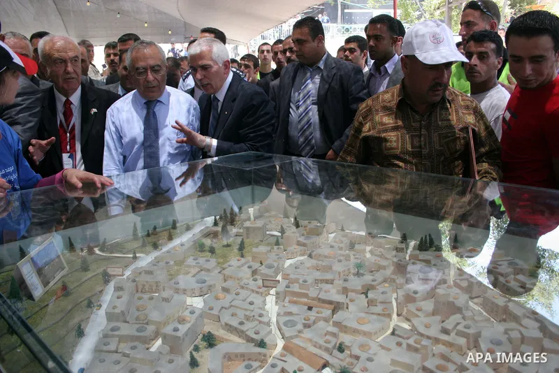 Palestinian prime minister Salam Fayyad participates in the International Conference to develop the centers of the historical cities and develop their economical situation, in the West Bank city of Hebron on July 19,2011...