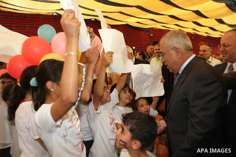 Palestinian prime minister Salam Fayyad participates in the International Conference to develop the centers of the historical cities and develop their economical situation, in the West Bank city of Hebron on July 19,2011...