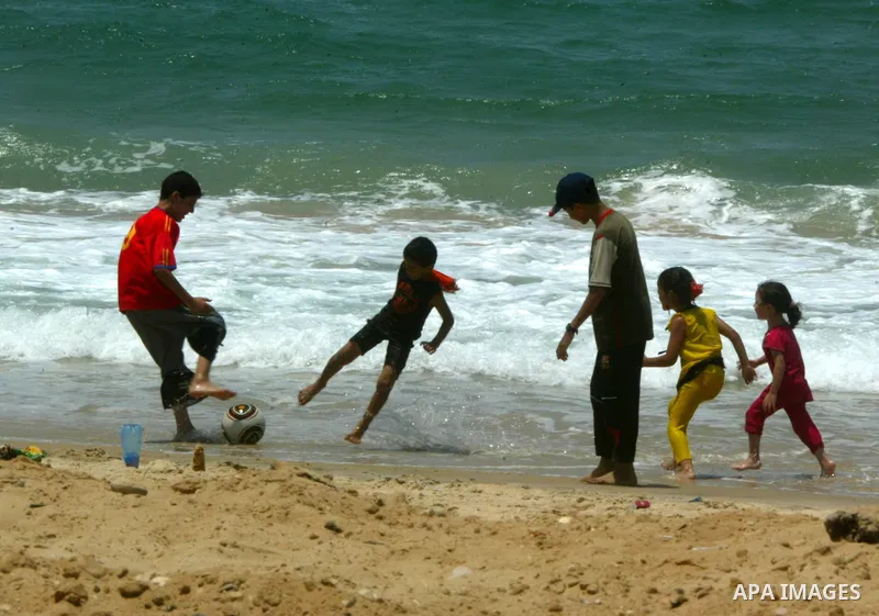 Palestinian children play at Rafah beach in the southern Gaza Strip on July 19, 2011. Israeli naval commandos on Tuesday seized control of a French ship attempting to break Israel's blockade of the Gaza Strip, reporting...
