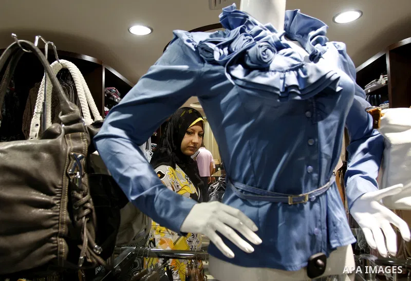 Palestinians shop at a newly open mall in Gaza city on July 19,2011. Photo by Mahmud Nassar