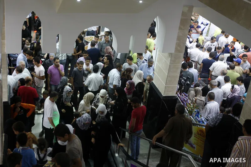 Palestinians shop at a newly open mall in Gaza city on July 19,2011. Photo by Mahmud Nassar