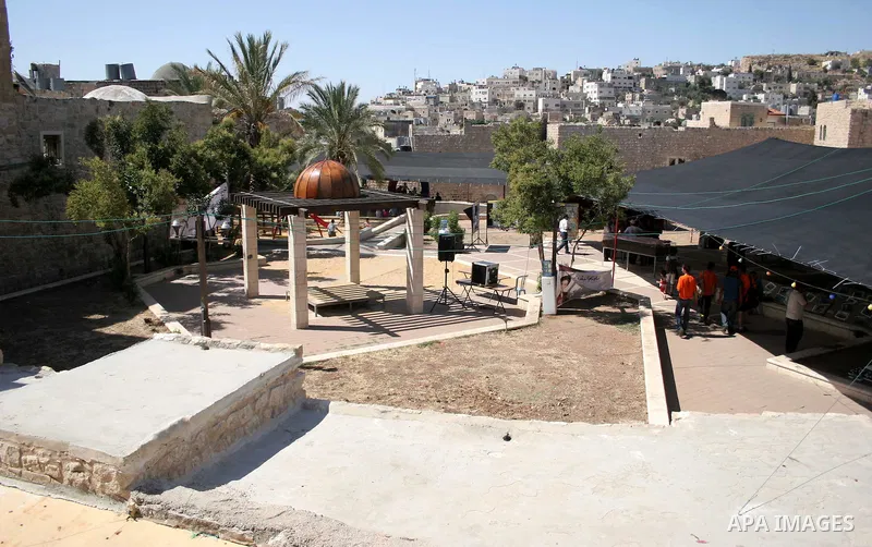 Palestinians enjoy the restoration places in the old city of Hebron on July 20,2011, as Palestinians participate in the second day of the International Conference to develop the centers of the historical cities and devel...