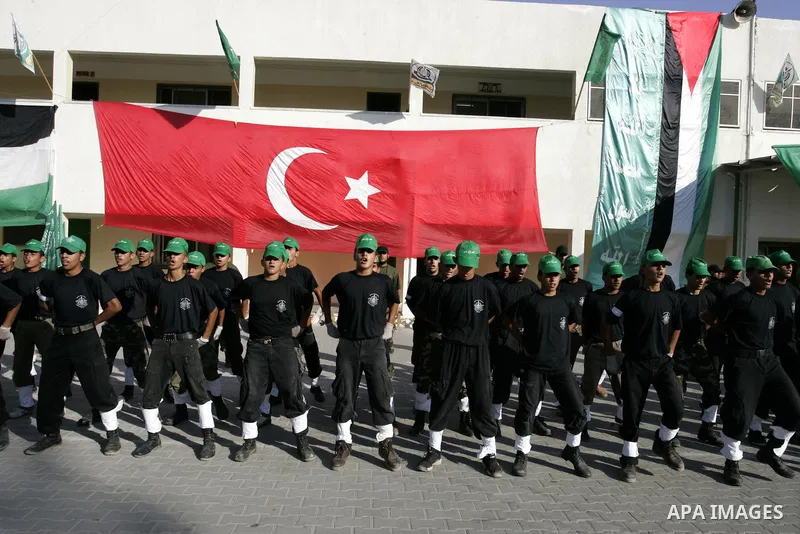 Palestinian youths parade with wooden weapons at a Hamas-run summer camp in Rafah, southern Gaza Strip, on July 20, 2011. The Islamist movement Hamas is holding summer camps throughout the Gaza Strip, where participants...