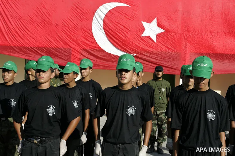 Palestinian youths parade with wooden weapons at a Hamas-run summer camp in Rafah, southern Gaza Strip, on July 20, 2011. The Islamist movement Hamas is holding summer camps throughout the Gaza Strip, where participants...