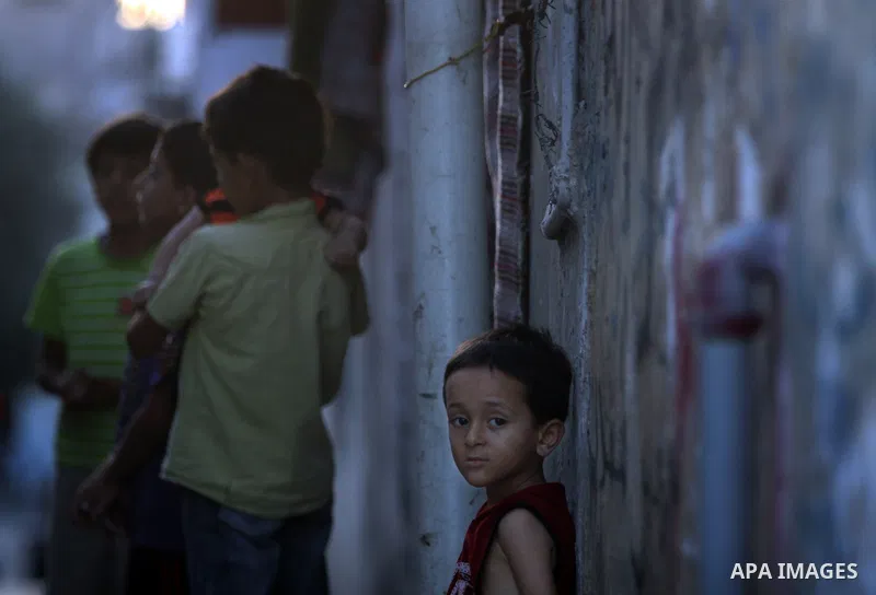 A Palestinian boy stands in front of her house in Jabaliya refugee camp in the northern area of the Gaza Strip on July 21, 2011. The UN Relief and Works Agency (UNRWA) will reduce some of its services for Palestinian ref...
