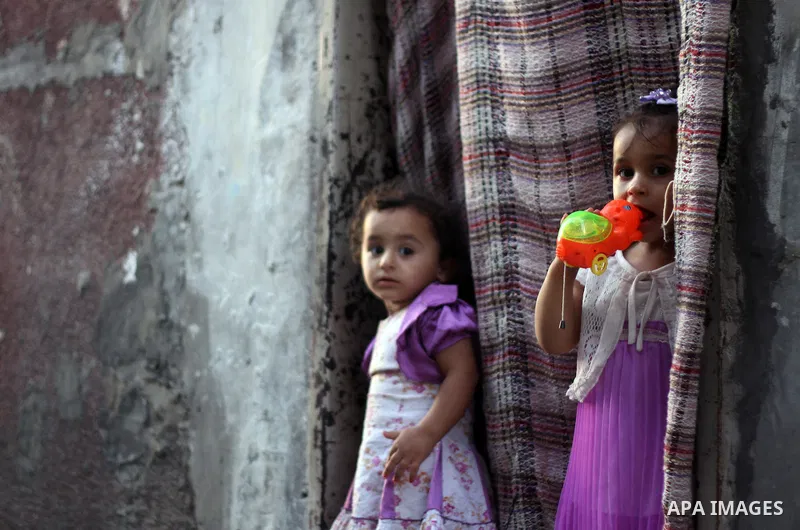 Palestinian children play at the Jabaliya refugee camp, which is the largest of the eight refugee camps in the Gaza Strip, with around 108,000 registered refugees living in the camp on July 21, 2011 Photo by Ali Jadallah