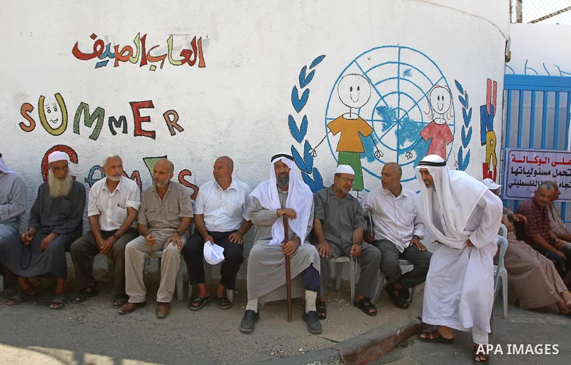 Palestinians take part during a protest infront of the UNRWA headquarters against the UNRWA decision to change its name and Reduce aid in Gaza city on July 21, 2011. Photo by Ashraf Amra