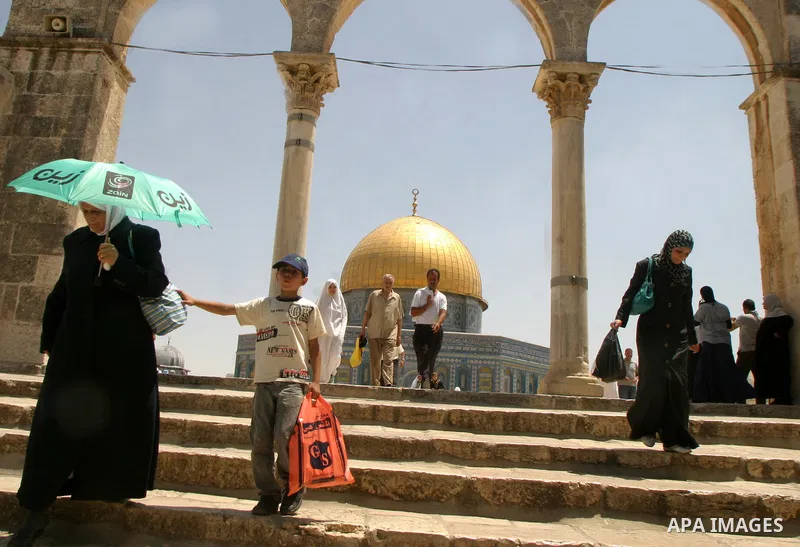 Palestinian Muslim worshippers walk in front of the Dome of the Rock after Friday Prayers at the Al-Aqsa Mosques compound in Jerusalem's Old City on July 22,2011. Photo by Mahfouz Abu Turk