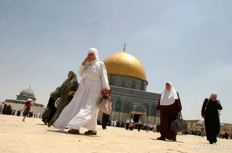 Palestinian Muslim worshippers walk in front of the Dome of the Rock after Friday Prayers at the Al-Aqsa Mosques compound in Jerusalem's Old City on July 22,2011. Photo by Mahfouz Abu Turk
