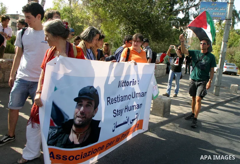 Palestinians, Israelis and foreign activists take part in a weekly demonstration in solidarity with the people of the Sheikh Jarrah neighbourhood who are being expelled from their homes in Jerusalem on July 22,2011. Phot...