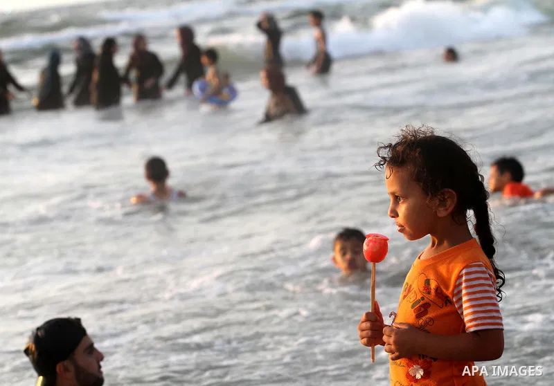 Palestinians cool off on the beach in Gaza City Friday, July 22, 2011. Photo by Mohammed Asad