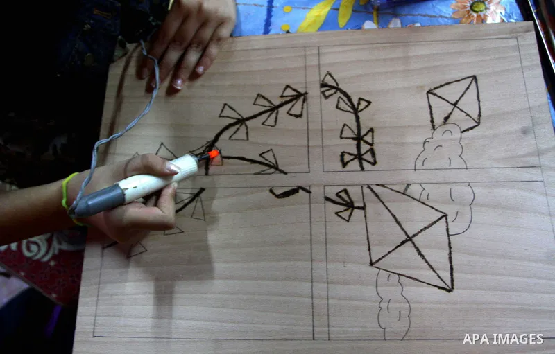 A Palestinian girl enjoys at a summer camp and performing handicrafts in Gaza City on July 23, 2011. Photo by Ashraf Amra