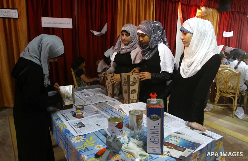 Palestinian girls enjoy at a summer camp and performing handicrafts in Gaza City on July 23, 2011. Photo by Ashraf Amra