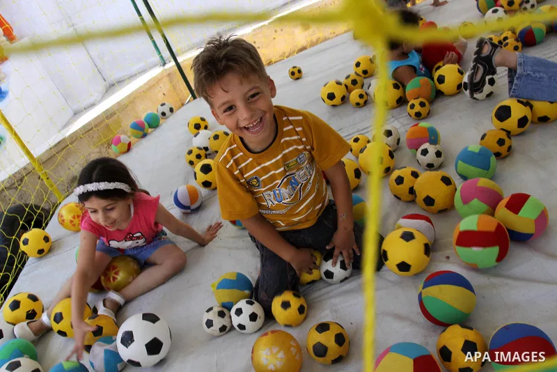 Palestinian children enjoy playing balls at Kindergarten in Gaza City on July 23, 2011. Photo by Mohammed Asad