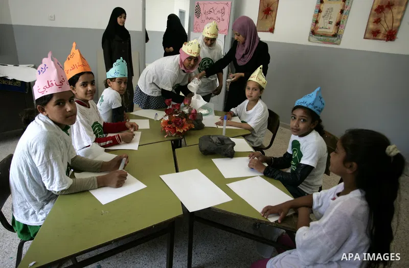 Palestinian children participate in a summer camp organised by the Ministry of Youth and Sports in the southern Gaza Strip town of Rafah on July 23,2011. Photo by Abed Rahim Khatib