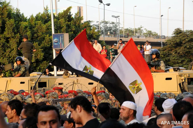 Egyptian protesters march towards the defence ministry, the headquarters of the Supreme Council of the Armed Forces, in Cairo on July 23, 2011 to show their anger at the ruling military's handling of the transition from...