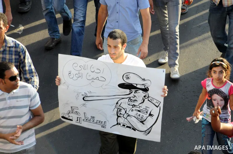Egyptian protesters march towards the defence ministry, the headquarters of the Supreme Council of the Armed Forces, in Cairo on July 23, 2011 to show their anger at the ruling military's handling of the transition from...