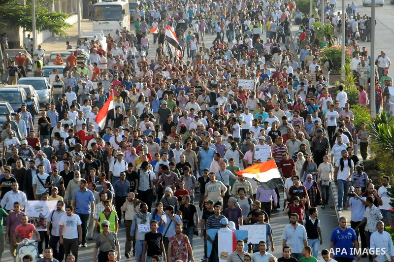 Egyptian protesters march towards the defence ministry, the headquarters of the Supreme Council of the Armed Forces, in Cairo on July 23, 2011 to show their anger at the ruling military's handling of the transition from...