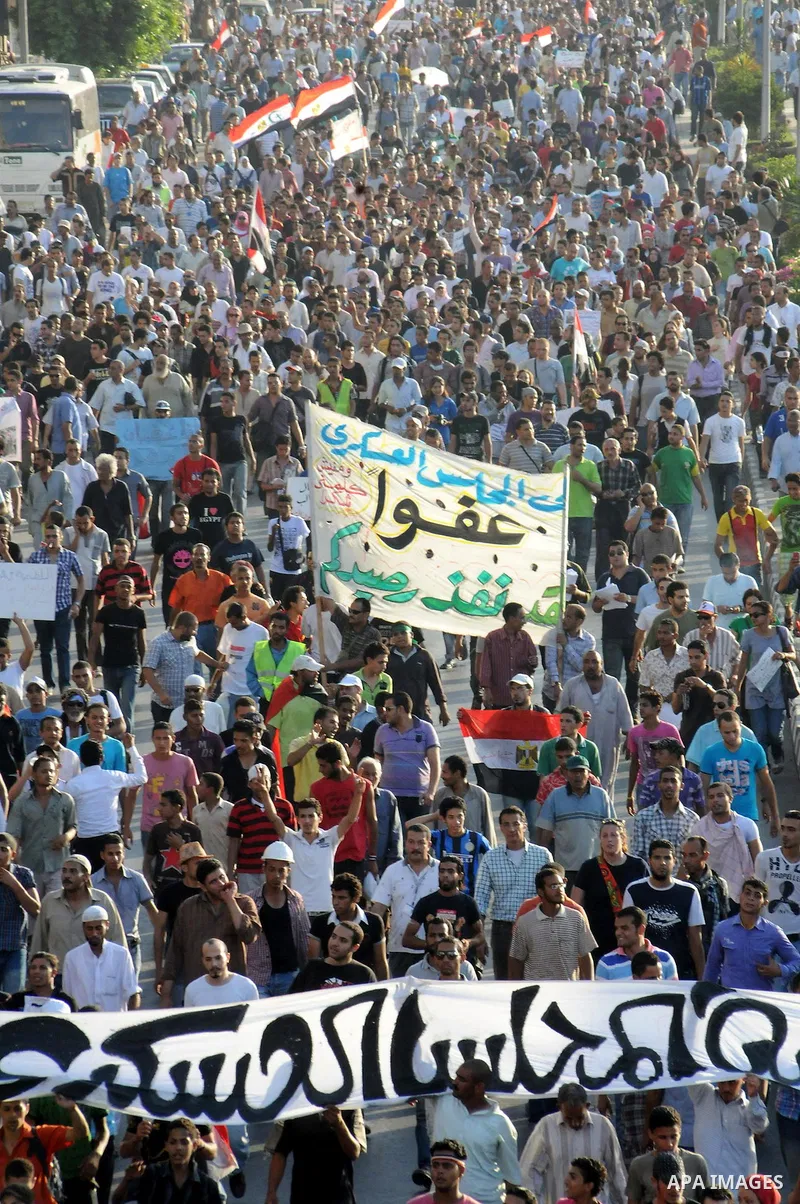 Egyptian protesters march towards the defence ministry, the headquarters of the Supreme Council of the Armed Forces, in Cairo on July 23, 2011 to show their anger at the ruling military's handling of the transition from...