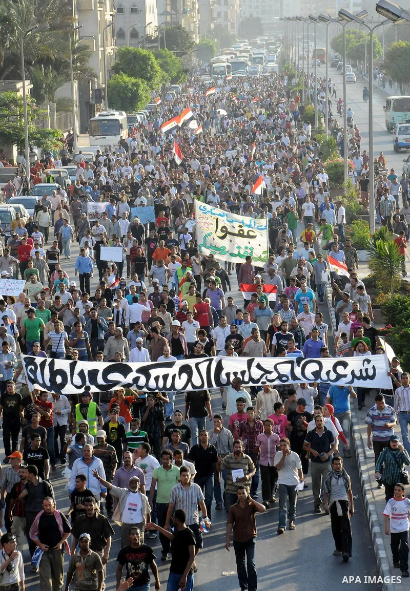 Egyptian protesters march towards the defence ministry, the headquarters of the Supreme Council of the Armed Forces, in Cairo on July 23, 2011 to show their anger at the ruling military's handling of the transition from...