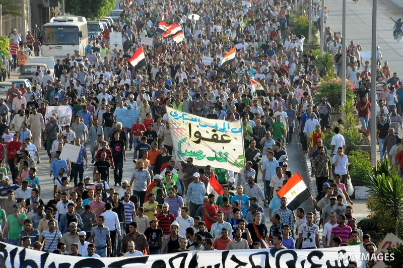 Egyptian protesters march towards the defence ministry, the headquarters of the Supreme Council of the Armed Forces, in Cairo on July 23, 2011 to show their anger at the ruling military's handling of the transition from...