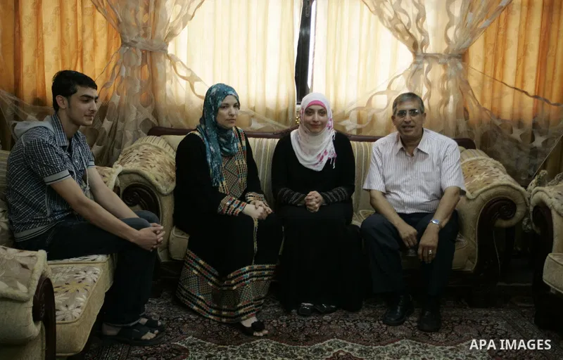 Hadeel Jamal Jaber, a Palestinian secondary school student and the winner of the fourth level in Palestine celebrates with her family in Gaza city on July 24, 2011. Photo by Abed Rahim Khatib