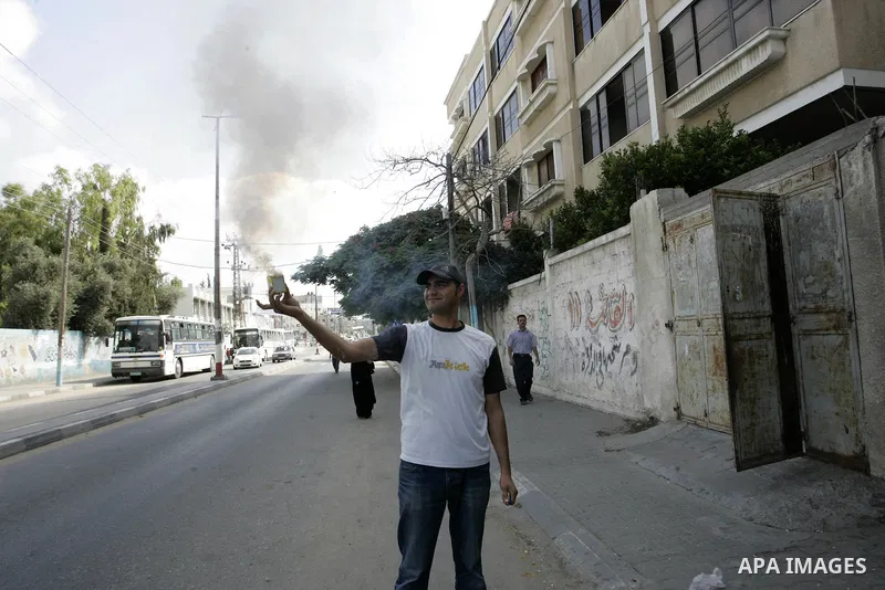 A Palestinian man celebrates after the results of high school exams, or "Tawjihe", in in Gaza city on July 24, 2011. The Ministry of Education in Gaza Strip and the West Bank announced the results together. Photo by Abed...