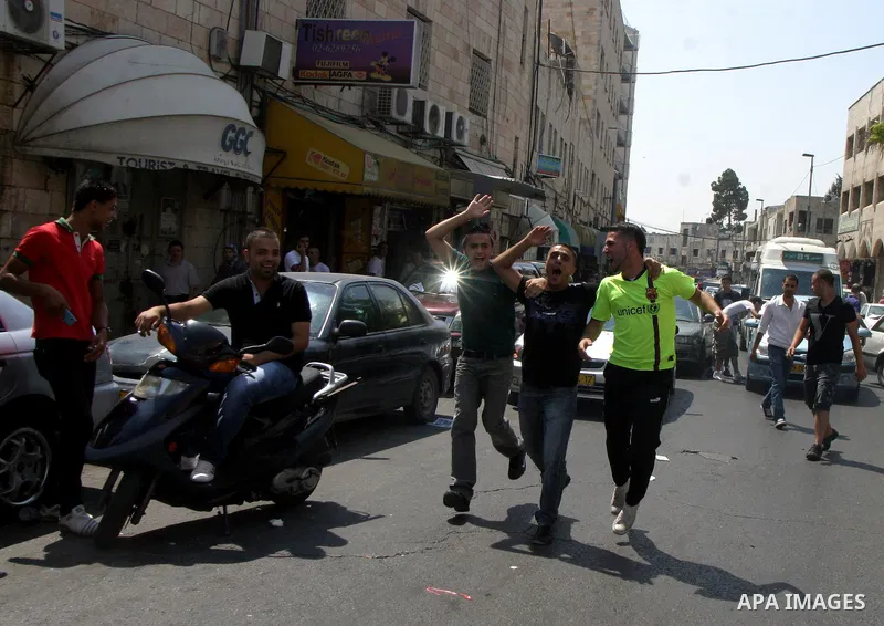 Palestinian students celebrate after they received their results of final high school exams, known as "Tawjihi" in Jerusalem's old city on July 24,2011.. Photo by Mahfouz Abu Turk