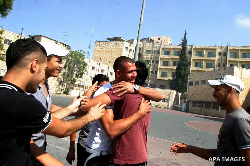 Palestinian students celebrate after they received their results of final high school exams, known as "Tawjihi" in Jerusalem's old city on July 24,2011.. Photo by Mahfouz Abu Turk