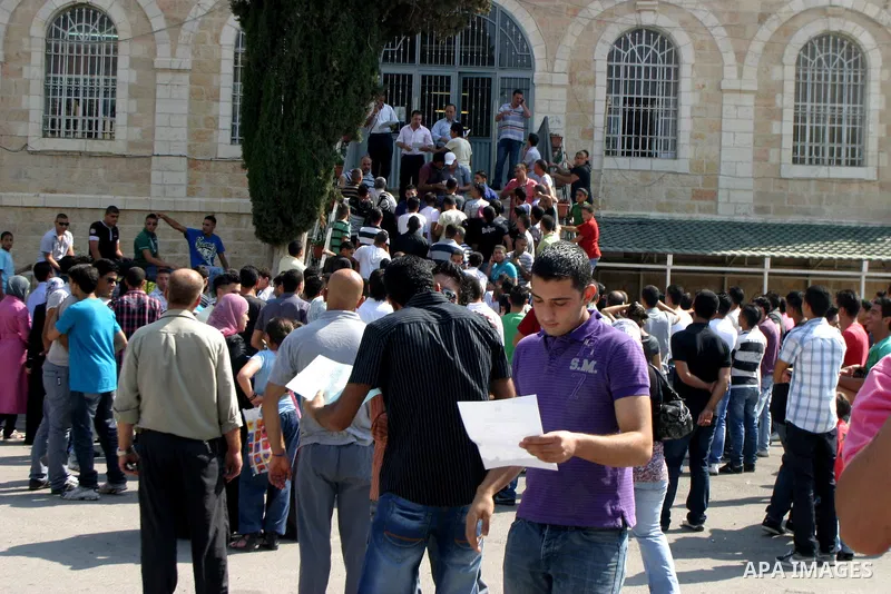 Palestinian students celebrate after they received their results of final high school exams, known as "Tawjihi" in Jerusalem's old city on July 24,2011.. Photo by Mahfouz Abu Turk