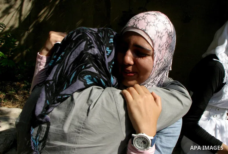 Palestinian students celebrate after they received their results of final high school exams, known as "Tawjihi" in Jerusalem's old city on July 24,2011.. Photo by Mahfouz Abu Turk