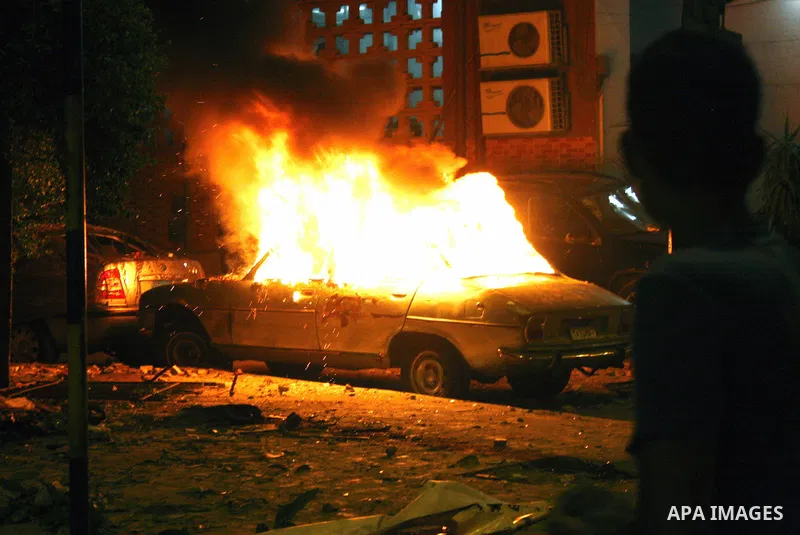 Demonstrators throw rocks during clashes with loyalists of the ruling military council in Abbasiya district, where the army blocked the road leading to the defence ministry, the headquarters of the Supreme Council of the...