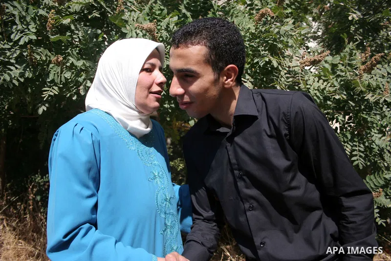 A Palestinian student from the top ten in the general secondary certificate in Palestine, Mohammed Jafar Karki with average of 99.5 % , is greeted by his family in the West Bank city of Hebron , Sunday, July 24, 2011. Ph...