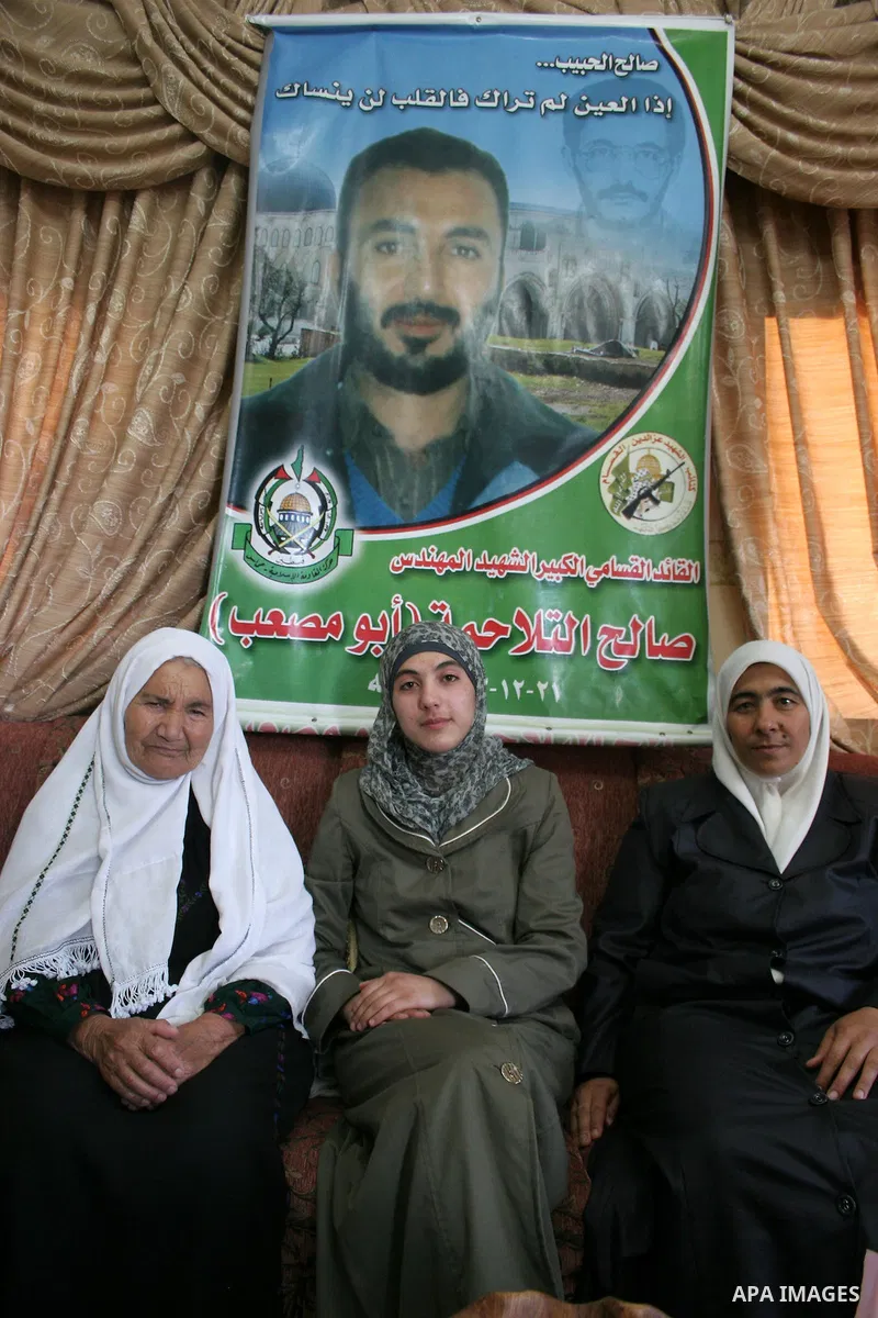 A Palestinian student from the top ten in the general secondary certificate in Palestine, Kataeb Saleh al-Talhma with average of 99.3 % , is greeted by her family in the West Bank city of Hebron , Sunday, July 24, 2011....