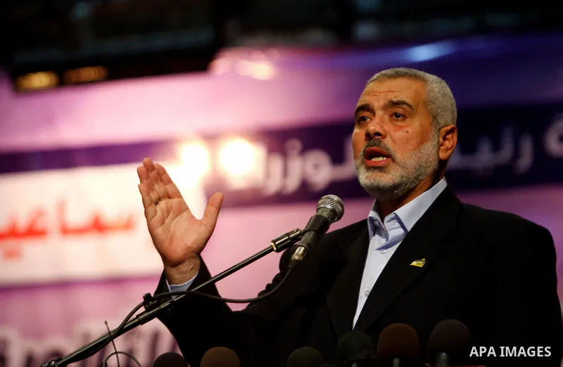 Palestinian Prime Minister in Gaza Strip, Ismail Haniya participates in a celebration in Gaza city on July 24,2011 to honor the students who gained the highest marks in the final high school exams, known as "Tawjihi" at...