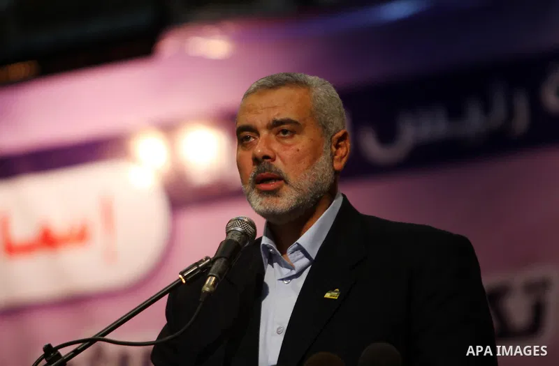 Palestinian Prime Minister in Gaza Strip, Ismail Haniya participates in a celebration in Gaza city on July 24,2011 to honor the students who gained the highest marks in the final high school exams, known as "Tawjihi" at...