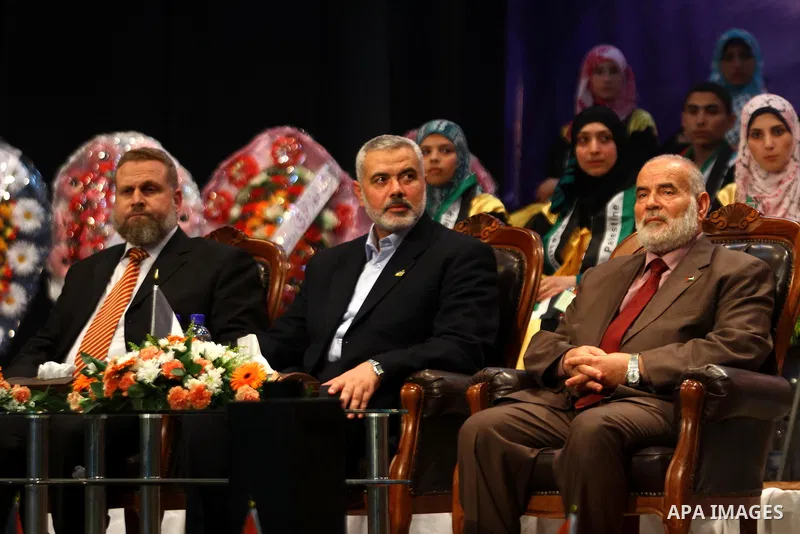Palestinian Prime Minister in Gaza Strip, Ismail Haniya participates in a celebration in Gaza city on July 24,2011 to honor the students who gained the highest marks in the final high school exams, known as "Tawjihi" at...