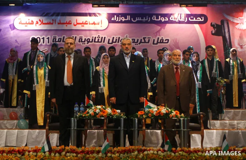 Palestinian Prime Minister in Gaza Strip, Ismail Haniya participates in a celebration in Gaza city on July 24,2011 to honor the students who gained the highest marks in the final high school exams, known as "Tawjihi" at...
