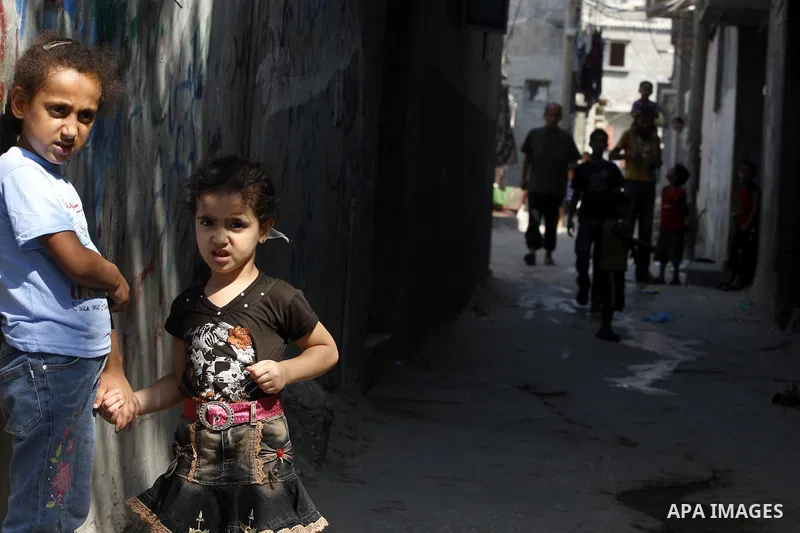 Palestinian children play in front of their house Al Shate` refugee camp in the west of Gaza City on July 25, 2011. Photo by Mahmud Nassar