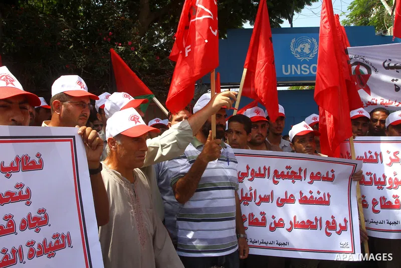 Palestinian supporters of the Democratic Front for the Liberation of Palestine (DFLP) take part in a demonstration infront of the UNSCO in Gaza city on July 26, 2011. In support of the Palestinian President Mahmoud abbas...